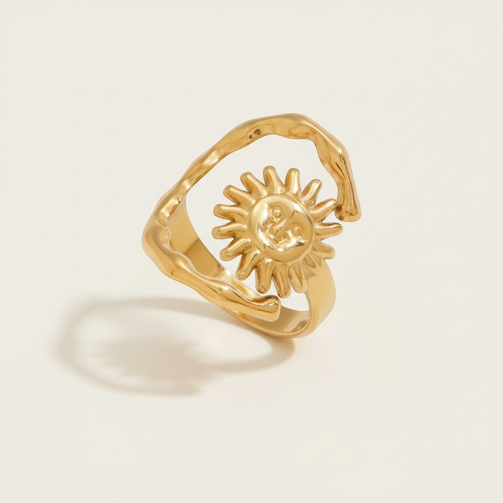 Seraphina Treasures Aegirion gold open ring with abstract sun design, adjustable band, symbolizes energy and renewal.
