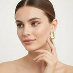 Seraphina Treasures Aelinor gold textured rectangular hoop earrings with smooth curved shape.