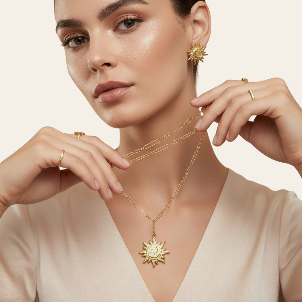 Seraphina Treasures Aetherion gold sun and moon pendant necklace with matching earrings. Celestial jewelry.