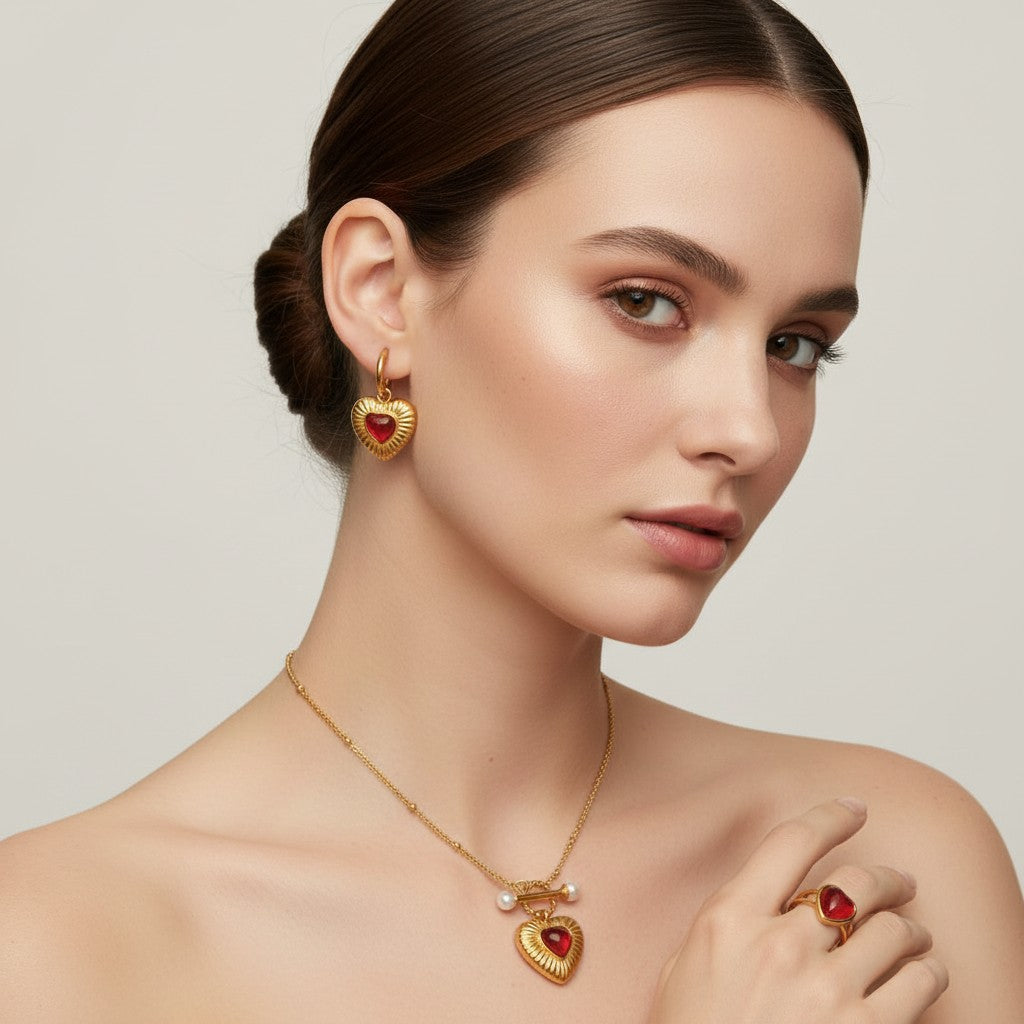 Seraphina Treasures gold heart jewelry set with red agate and pearls: necklace, earrings, and ring.