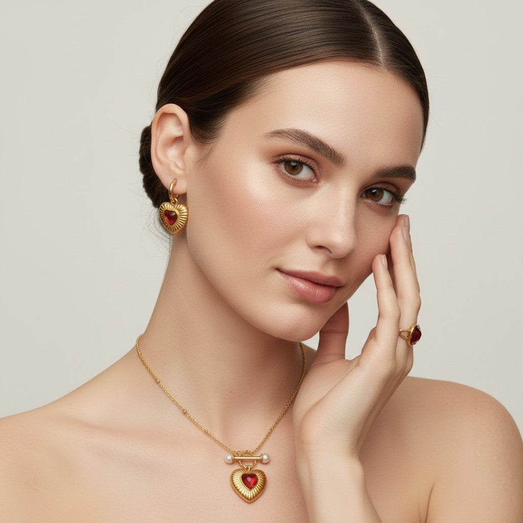 Seraphina Treasures gold heart pendant necklace with red agate and pearl, matching earrings and ring.