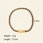Seraphina Treasures Albina bracelet with black crystal zircon accents and gold-tone clasp. 17.5cm length.