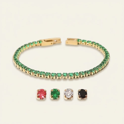 Seraphina Treasures Albina gold tennis bracelet with green crystal zircon accents. Features a delicate chain and clasp.