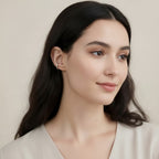 Seraphina Treasures Allegra ear clip in silver-tone metal with a geometric design, worn by a model.