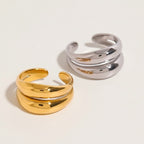 Seraphina Treasures Althea open ring in gold and silver, featuring a modern double band design with smooth, curved lines.