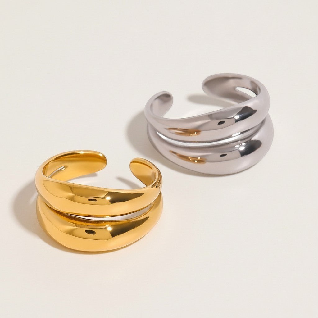 Seraphina Treasures Althea open ring in gold and silver, featuring a modern double band design with smooth, curved lines.