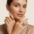 Seraphina Treasures Althea ring in gold and silver, featuring a modern open geometric design on a model's hand.