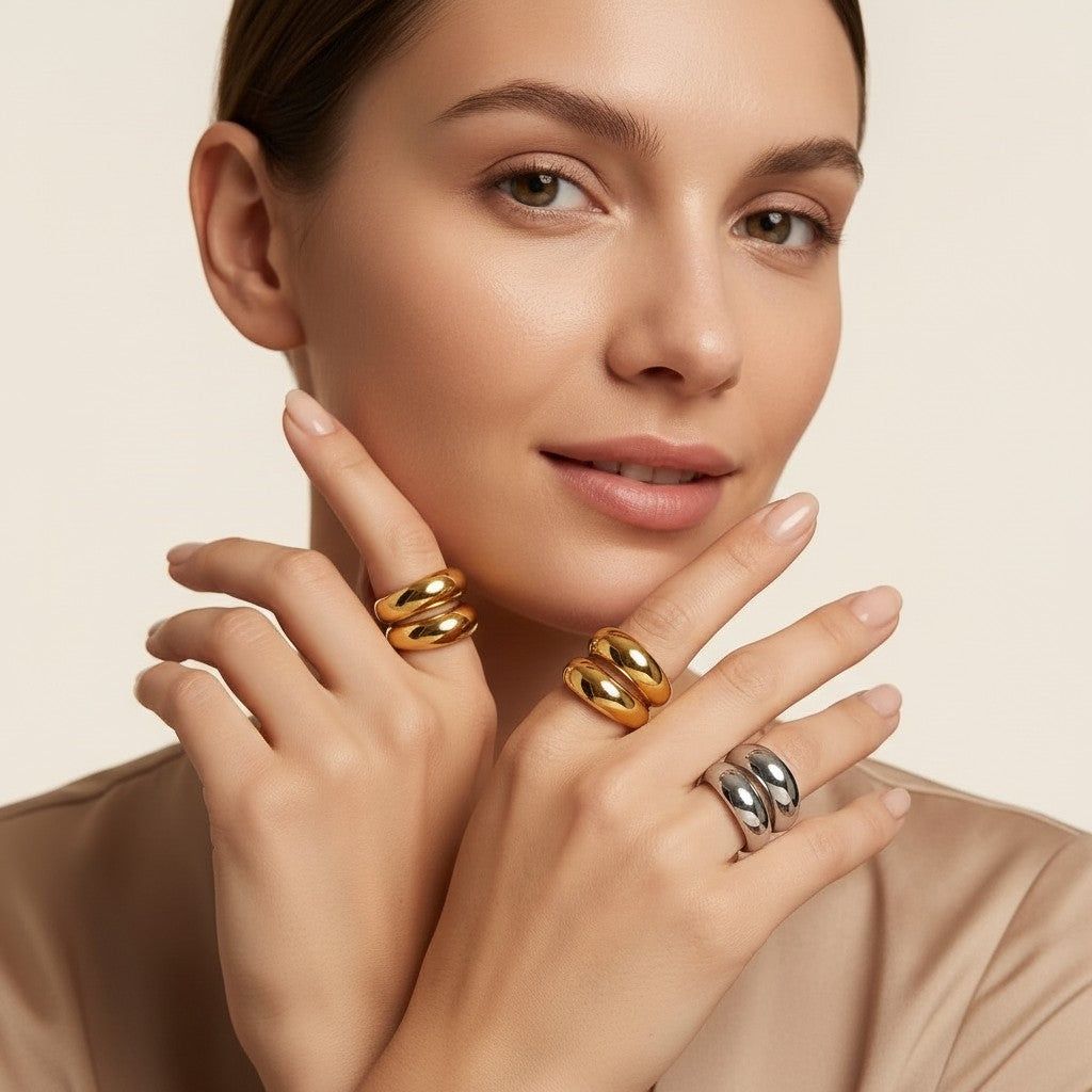Seraphina Treasures Althea ring in gold and silver, featuring a modern open geometric design on a model's hand.
