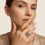 Seraphina Treasures Althea ring in gold and silver, featuring a modern open design with geometric lines on a woman's hand.