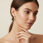 Seraphina Treasures Amara gold hoop earrings on a model. Classic, versatile, and comfortable for all-day wear.