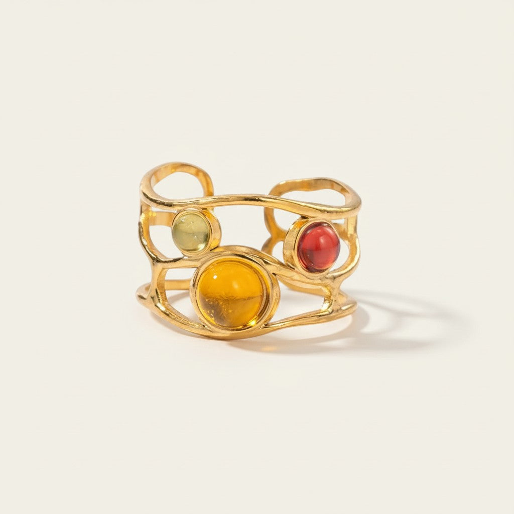 Seraphina Treasures Amarelle gold-tone ring with wavy design and three colorful resin cabochons: yellow, red, and green.