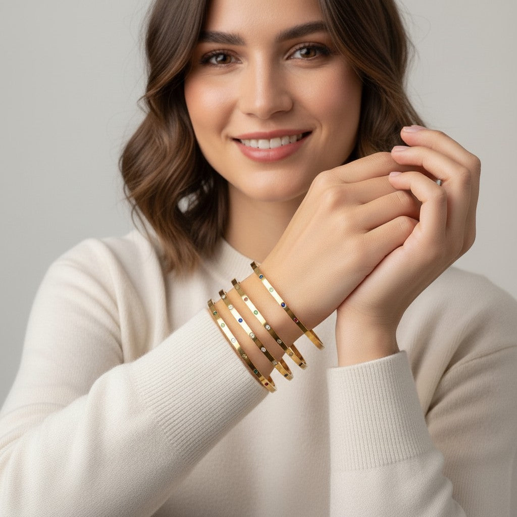 Seraphina Treasures Amaris gold-tone bangles with colorful zircon stones, adjustable open design.