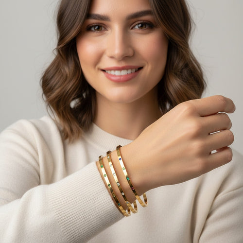 Seraphina Treasures Amaris gold-tone bracelets with colorful zircon stones and clear crystals. Adjustable open design.