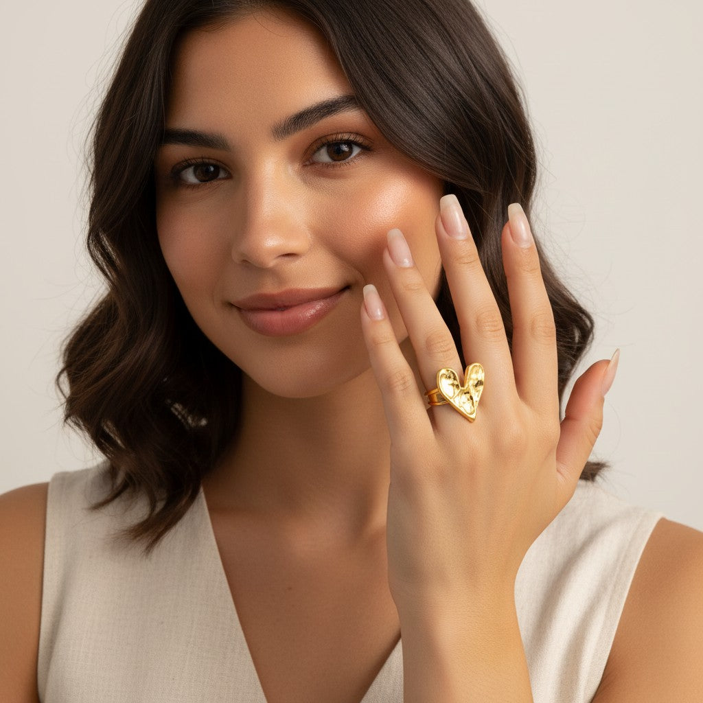 Seraphina Treasures Amoreth gold heart ring with textured finish, symbolizing love and affection. Open heart design.