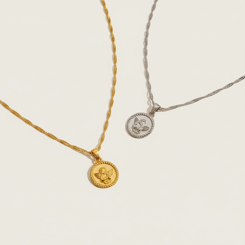 Seraphina Treasures gold and silver Angelure necklaces with delicate chains and round pendants featuring an angel motif.