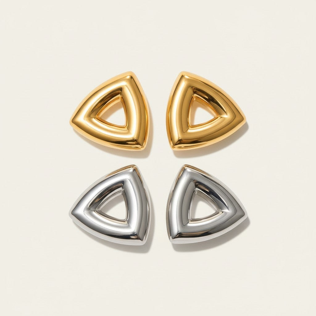 Seraphina Treasures Arcana gold and silver tone geometric triangle earrings.