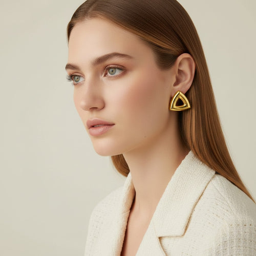 Seraphina Treasures Arcana silver geometric triangle earrings on a model. Modern, minimalist design.