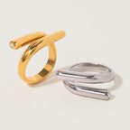 Seraphina Treasures Ariadne gold and silver rings with zirconia accents and modern spiral design.