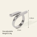 Seraphina Treasures Ariadne ring with a unique modern shape and sparkling zirconia edge. Silver-tone metal.