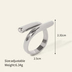 Seraphina Treasures Ariadne ring with a unique modern shape and sparkling zirconia edge. Silver-tone metal.