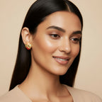 Seraphina Treasures Athenara earrings with peach and red enamel detail and gold textured finish.