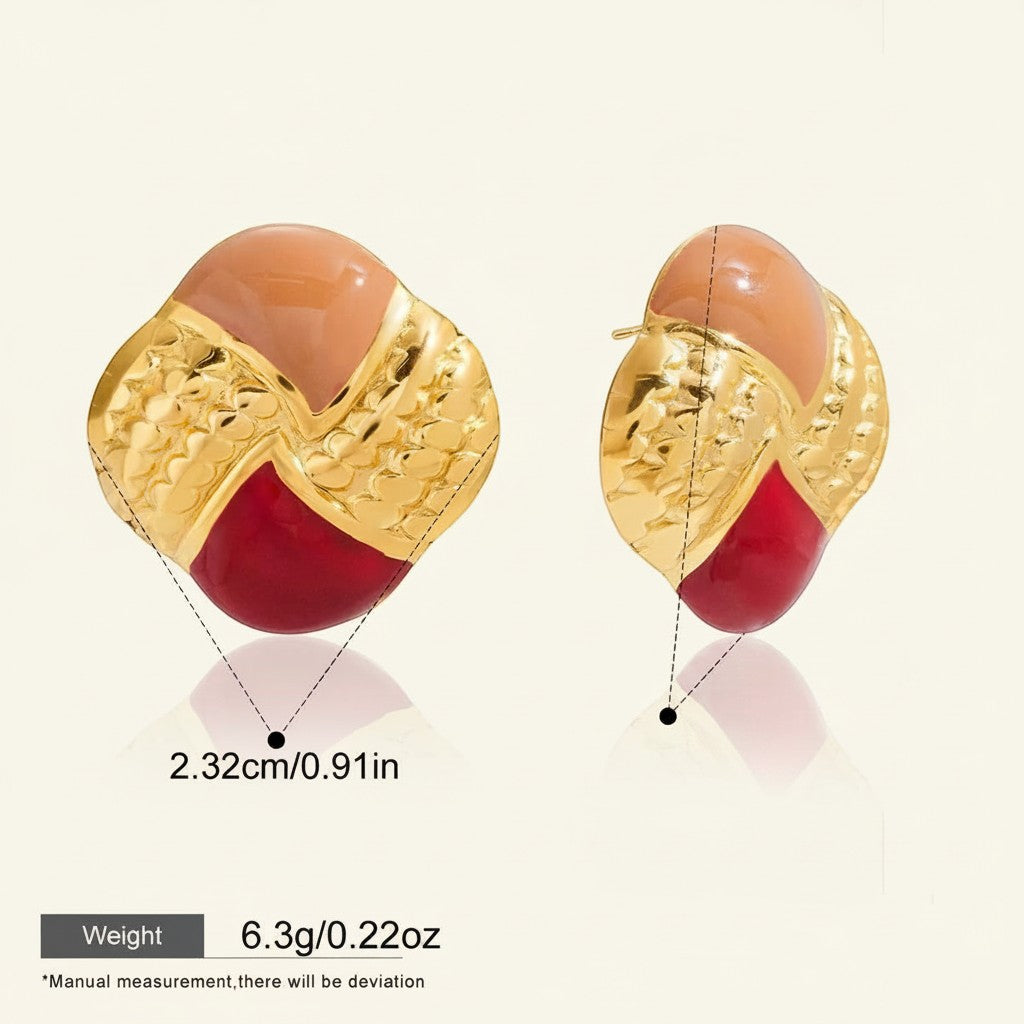 Seraphina Treasures Athenara earrings with gold, peach, and red enamel in an oil drip pattern. Textured gold metal.