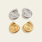 Seraphina Treasures Aurelia gold and silver spiral shell earrings with textured finish.