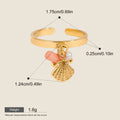 Seraphina Treasures Aurelis gold ring with pink coral, pearl, and shell charm. Adjustable, waterproof, hypoallergenic.