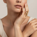 Seraphina Treasures Aurelune gold abstract heart ring with geometric details on a woman's hand.