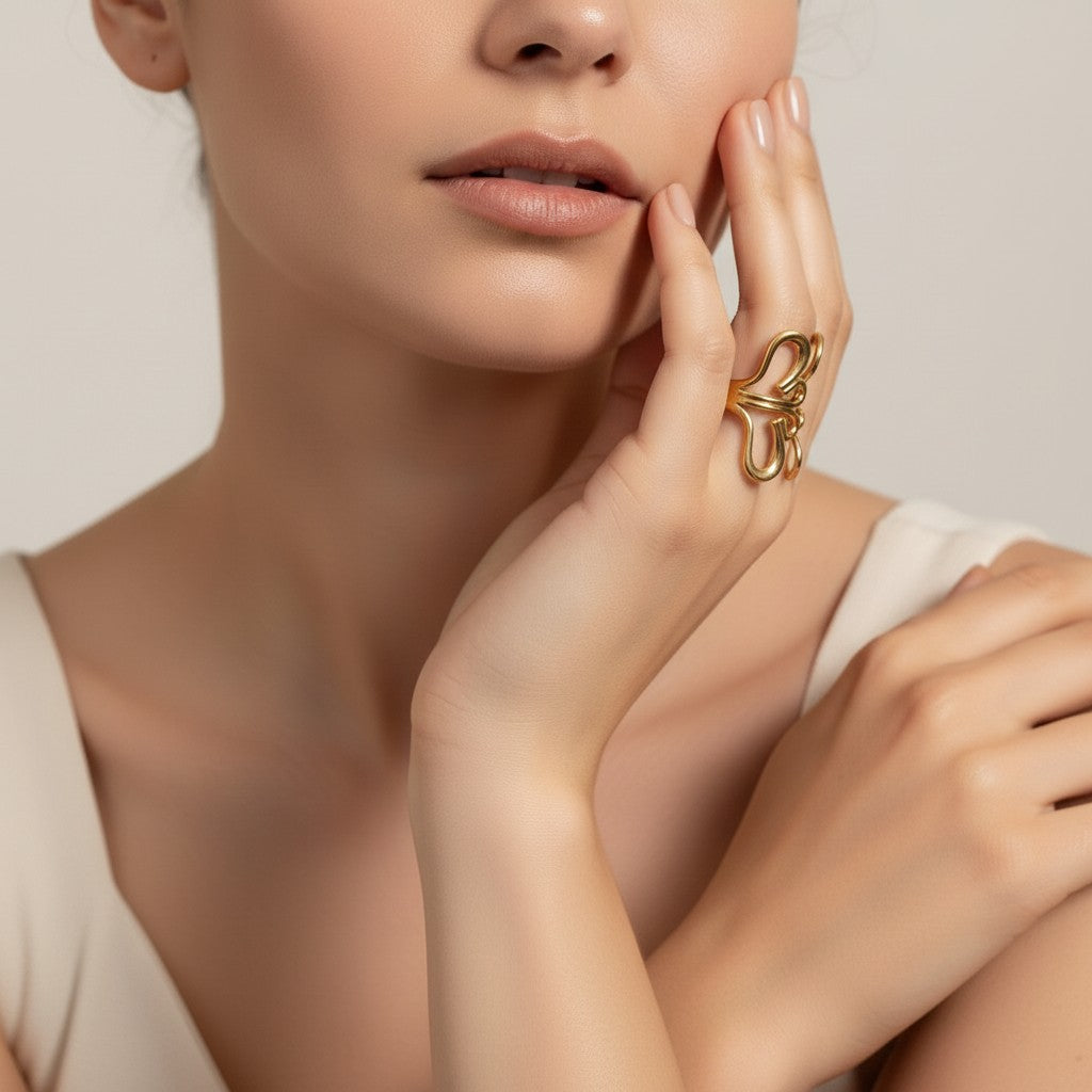 Seraphina Treasures Aurelune gold abstract heart ring with geometric details on a woman's hand.