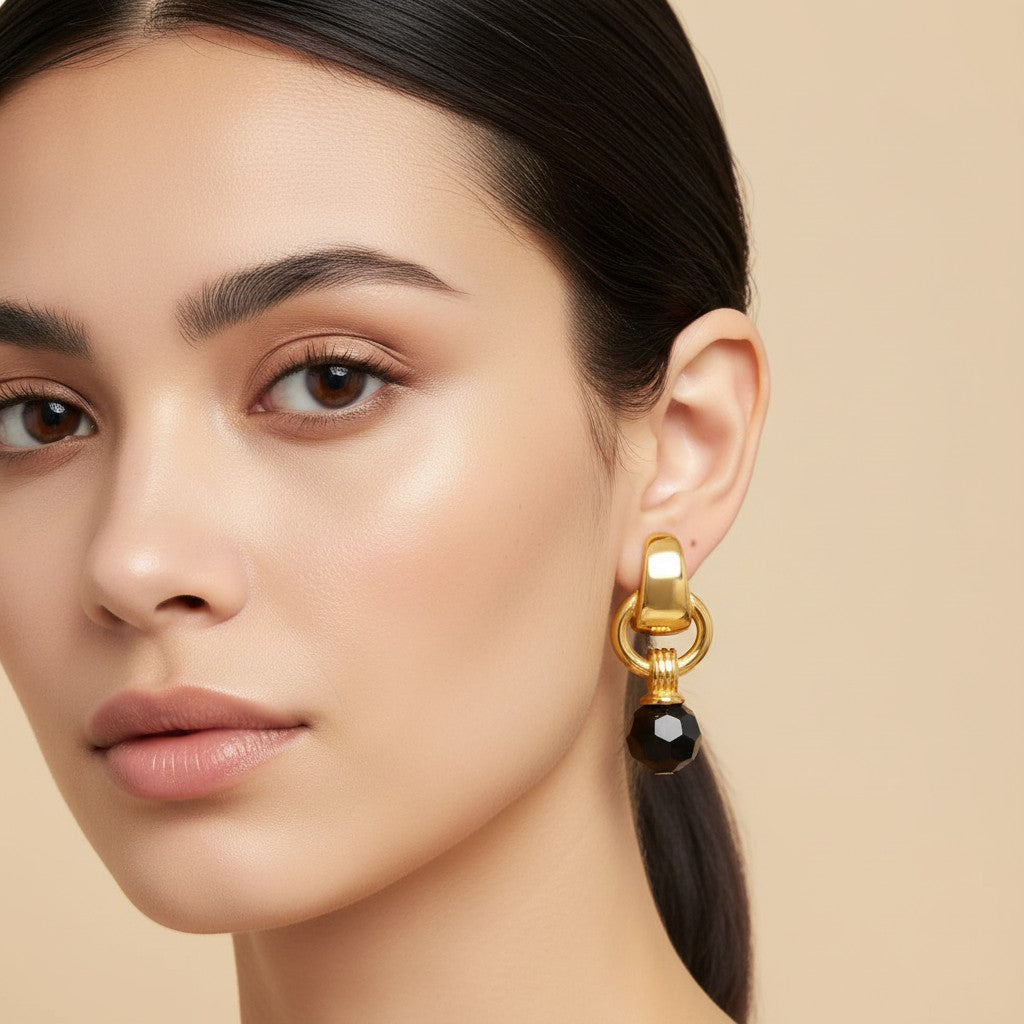 Seraphina Treasures Aurethia gold hoop earrings with black crystal drop, hypoallergenic and waterproof.