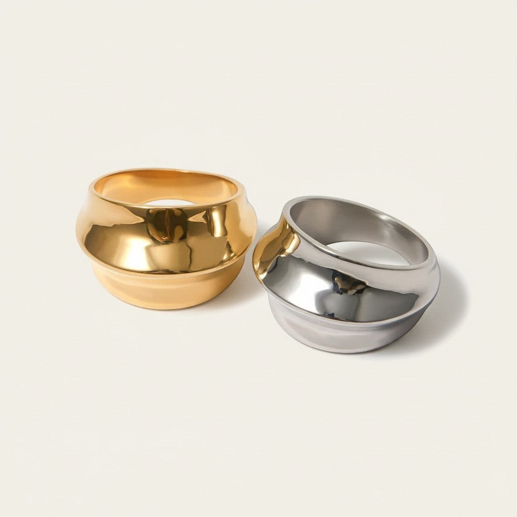 Seraphina Treasures Azura ring in gold and silver, featuring a unique concave and convex design for a modern statement.