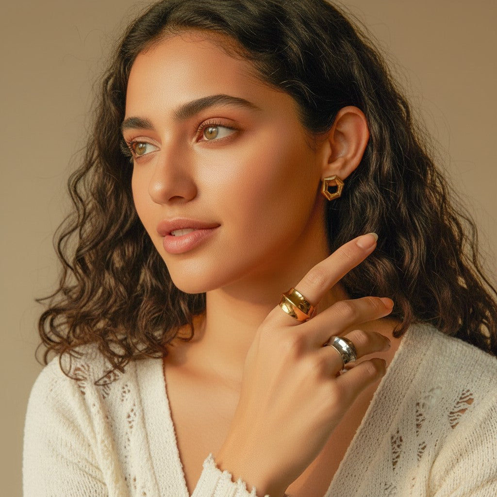 Seraphina Treasures Azura ring in silver and gold, featuring a bold concave and convex design. Modern statement jewelry.