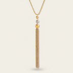 Seraphina Treasures Bastet necklace with gold and silver bead accents and a long, multi-strand tassel.