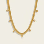 Seraphina Treasures Bia gold necklace with zirconia stones on a flat herringbone chain, perfect for everyday elegance.