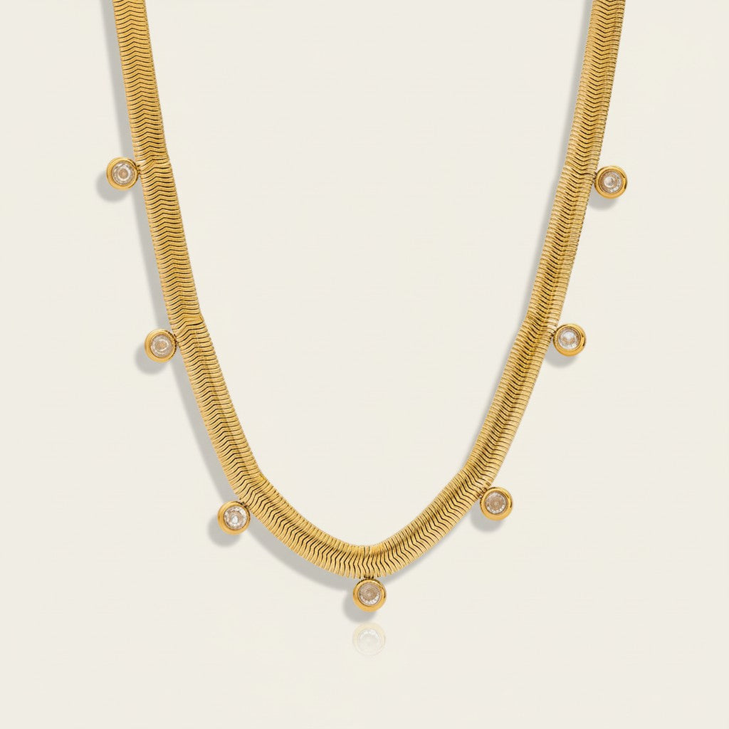 Seraphina Treasures Bia gold necklace with zirconia stones on a flat herringbone chain, perfect for everyday elegance.