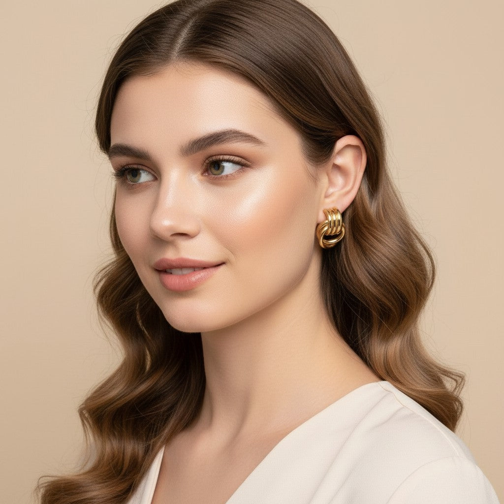 Seraphina Treasures Calypsa gold knot earrings with a unique thread wrap design, perfect for everyday wear.