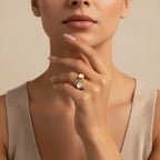 Seraphina Treasures Calyra gold ring with two round mother-of-pearl stones on a woman's hand.