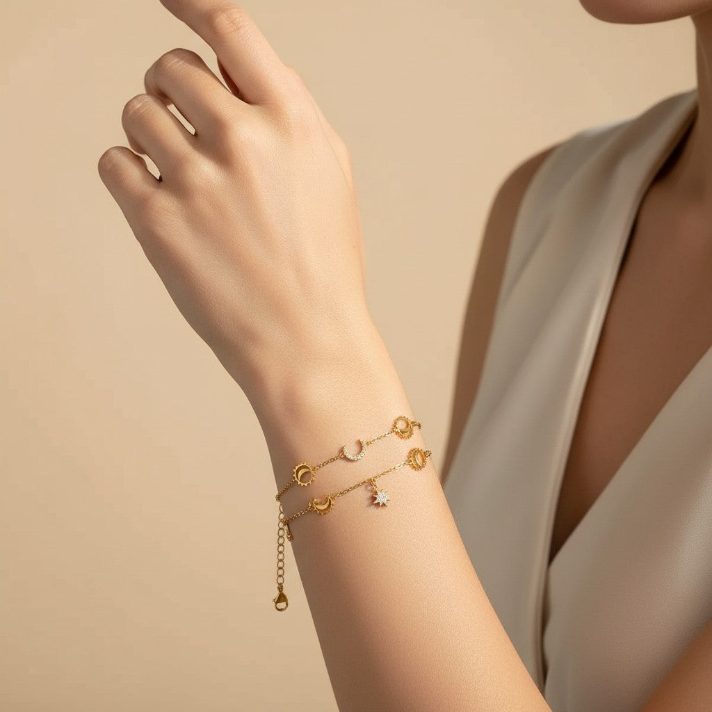 Seraphina Treasures Camilla gold bracelets with moon, star, and sun charms, accented with sparkling stones.