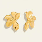 Seraphina Treasures Cassynelle gold-tone metal flower stud earrings with a polished finish.