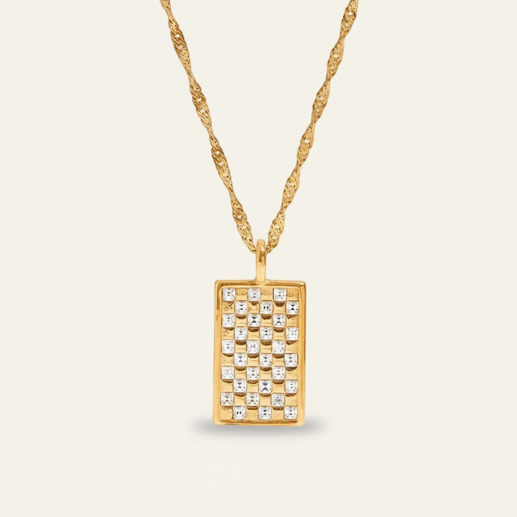 Seraphina Treasures Cecilia necklace with a gold chain and rectangular pendant inlaid with sparkling white zircon stones in a checkerboard pattern.