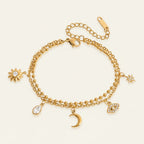 Seraphina Treasures gold-tone bracelet with sun, moon, star, water drop, and evil eye charms.