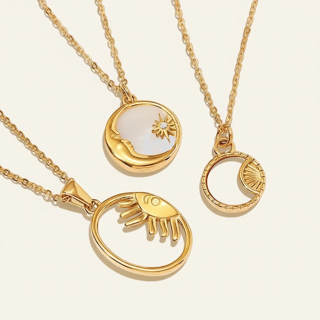 Seraphina Treasures gold necklaces with celestial pendants: moon, sun, and star motifs. Natural shell detail.