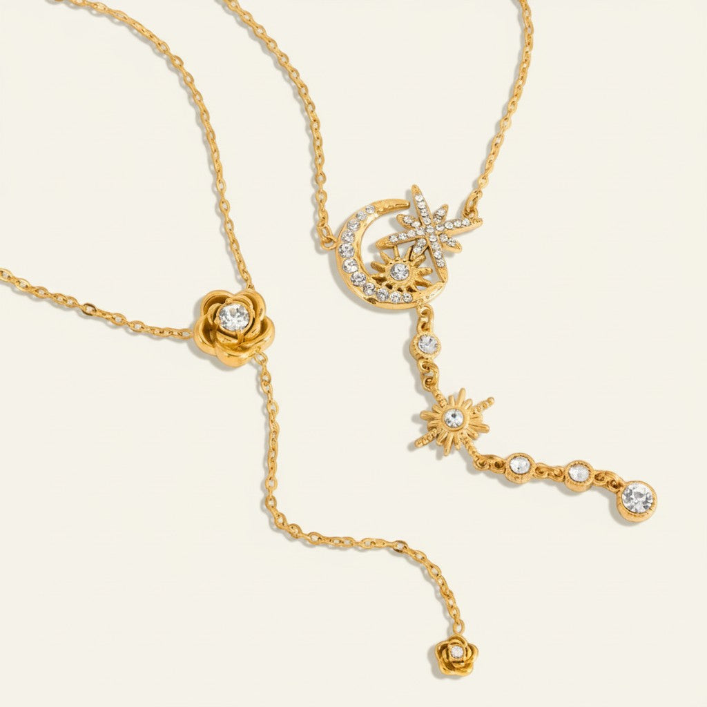 Seraphina Treasures gold necklaces with celestial moon, star, sun charms and a rose pendant, all with sparkling crystals.