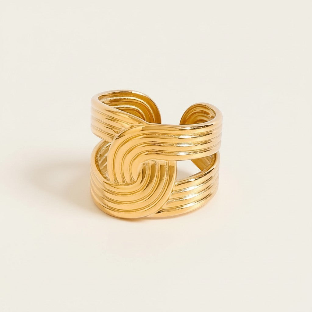 Seraphina Treasures Celestique gold-tone open ring with intricate threaded wrap detail. Adjustable fit.