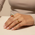 Seraphina Treasures Myrrine gold rings with red cherry enamel and clear zirconia stones.