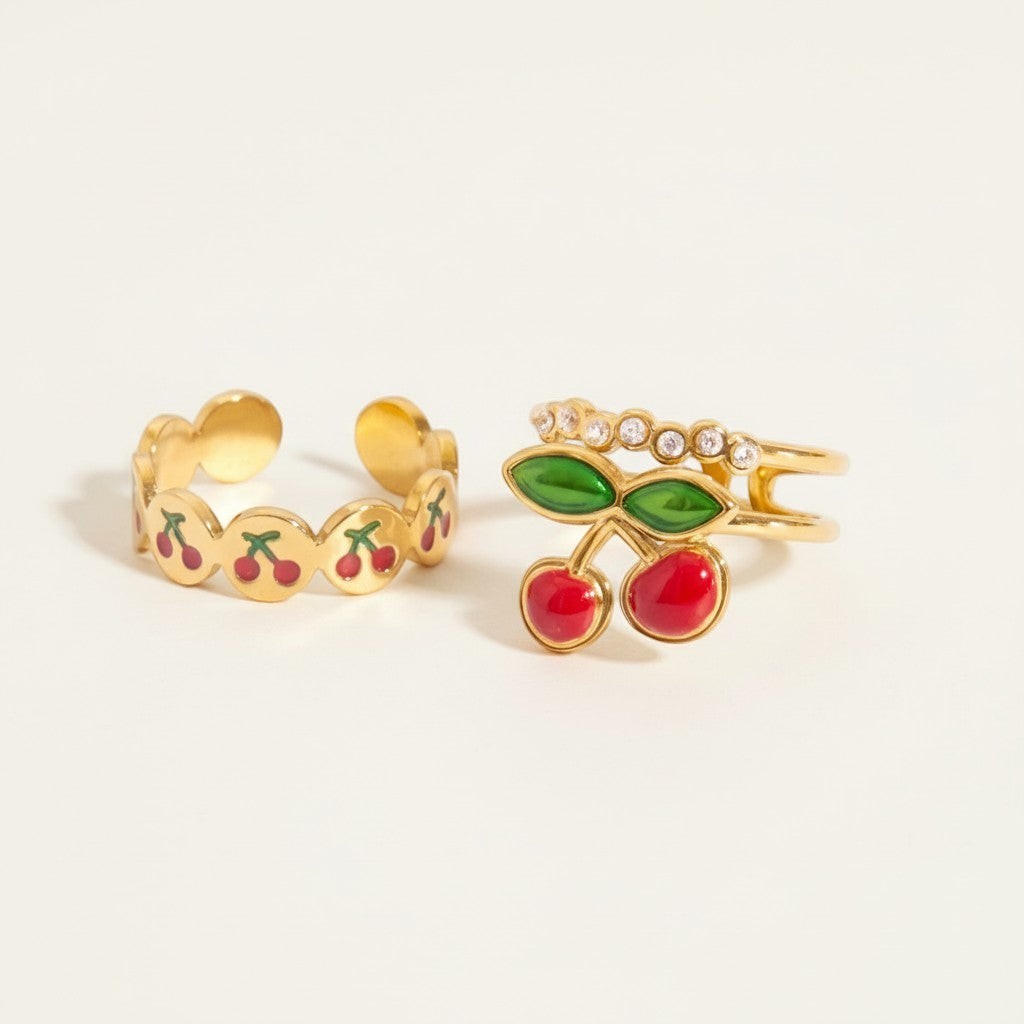 Seraphina Treasures gold rings with cherry design and zirconia stones. Adjustable open bands.