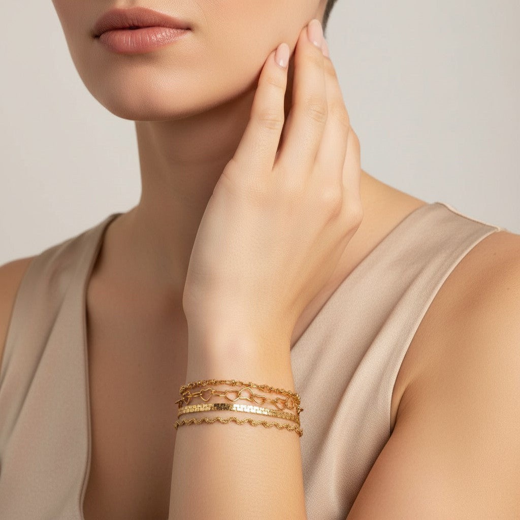 Seraphina Treasures Chrysara gold bracelets with heart, rope, and flat link chain designs.