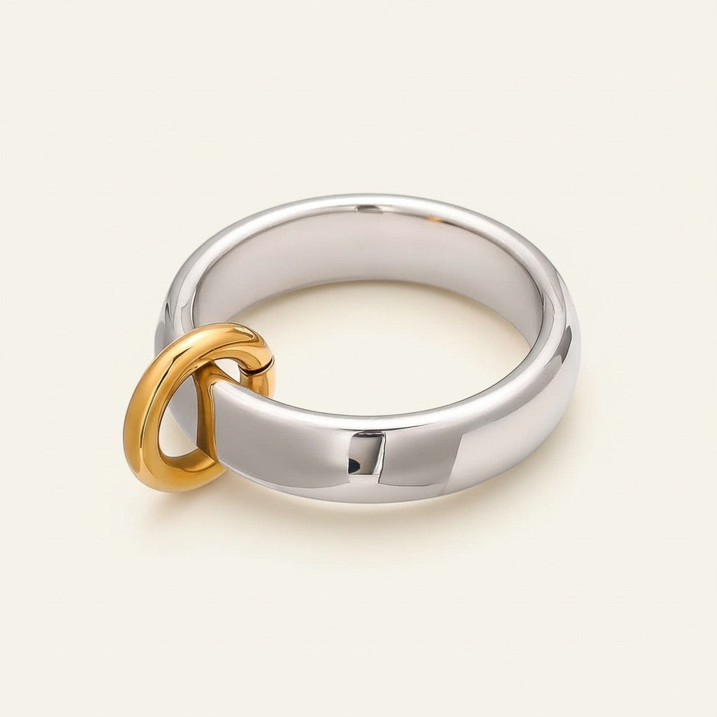 Seraphina Treasures Cirkelle ring, silver band with a gold dangle hoop detail. Elegant and modern jewelry.