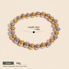 Seraphina Treasures Clio bracelet with alternating gold and silver stainless steel beads. Elastic design for a comfortable fit.